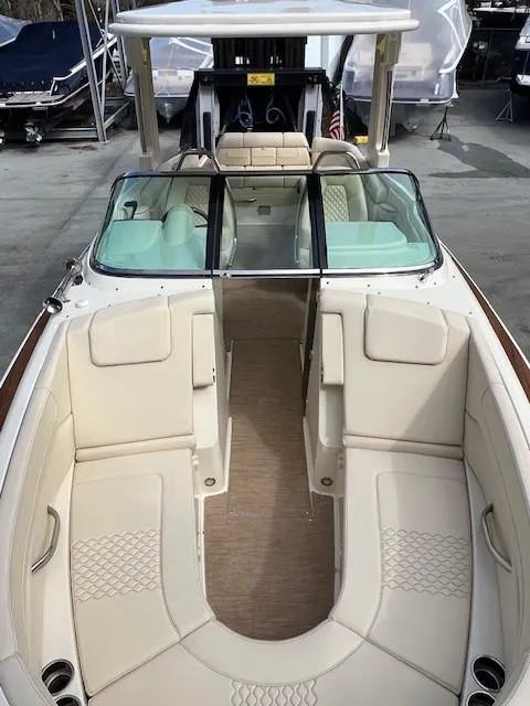 Slide: The Image of 2022 Chris-Craft Launch 28 GT boat with spacious seating and elegant design. - 19