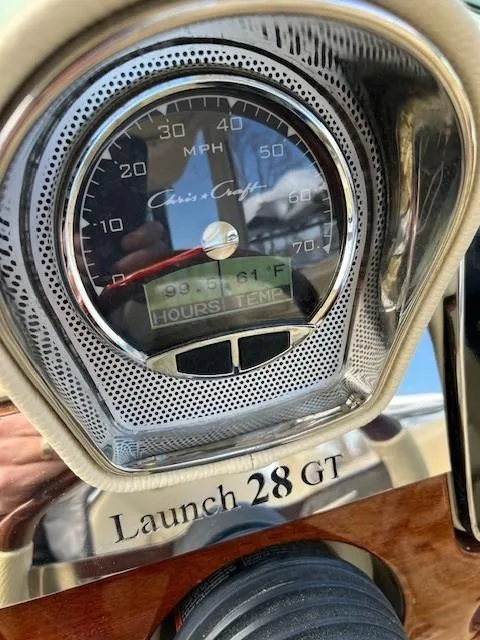 Slide: The Image of 2022 Chris-Craft Launch 28 GT speedometer displaying 61°F temperature. - 20