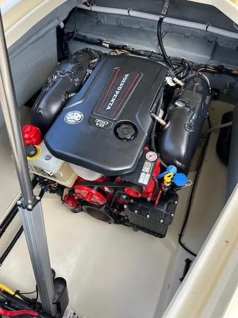 Slide: The Image of 2022 Chris-Craft Launch 28 GT engine compartment showcasing powerful marine engine. - 22