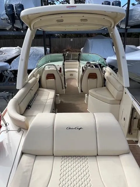 Slide: The Image of 2022 Chris-Craft Launch 28 GT boat with luxurious beige seating and modern design. - 8