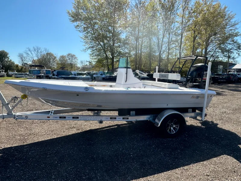 Slide: The Image of 2025 Action Craft 17 Flats Flyfisher boat on trailer, parked outdoors. - 10