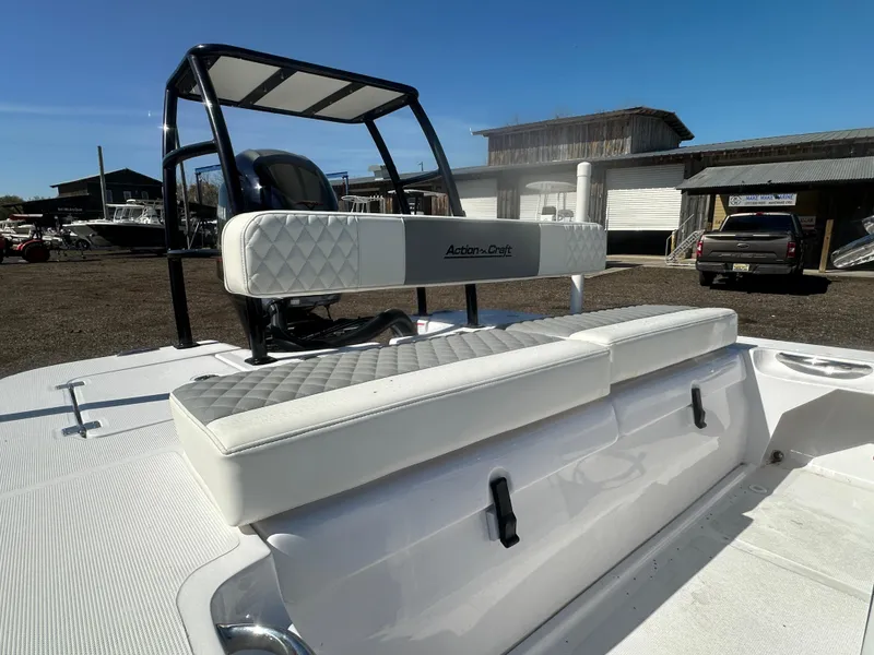 Slide: The Image of 2025 Action Craft 17 Flats Flyfisher boat with white seating and sleek design. - 13