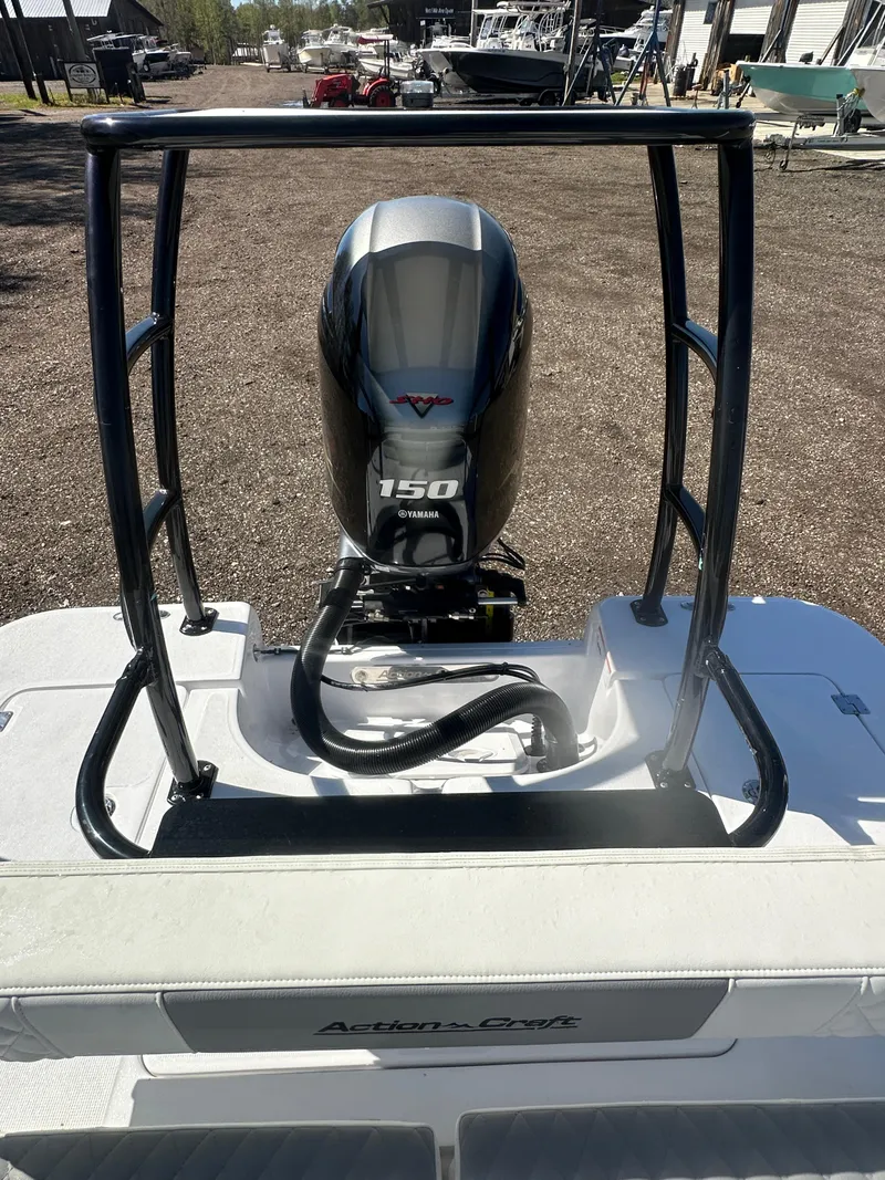 Slide: The Image of 2025 Action Craft 17 Flats Flyfisher boat with powerful 150 HP engine, rear view. - 21