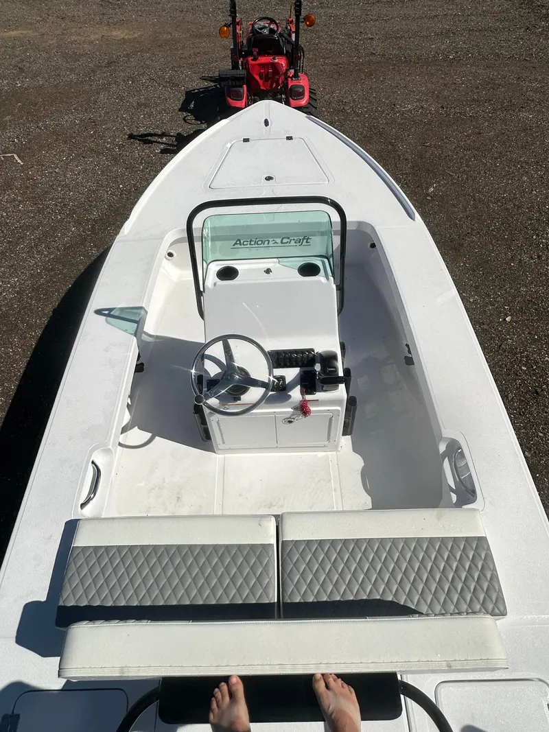 Slide: The Image of 2025 Action Craft 17 Flats Flyfisher boat with steering console and seating. - 22