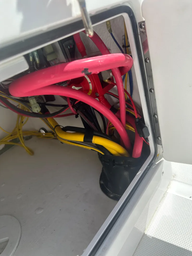 Slide: The Image of Wiring compartment of 2025 Action Craft 17 Flats Flyfisher boat with colorful cables. - 23