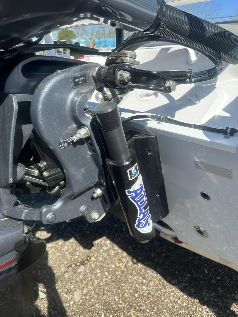 Slide: The Image of 2025 Action Craft 17 Flats Flyfisher boat engine detail with hydraulic components. - 7