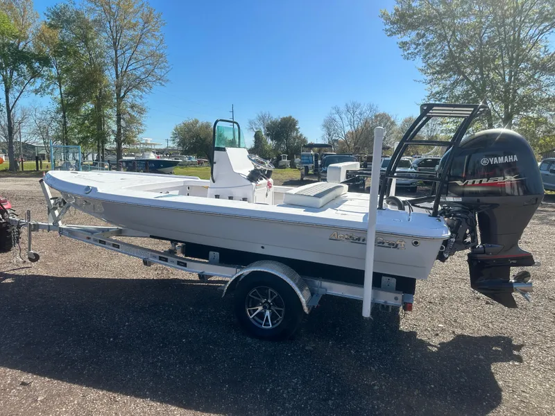 Slide: The Image of 2025 Action Craft 17 Flats Flyfisher boat on trailer, parked outdoors. - 9