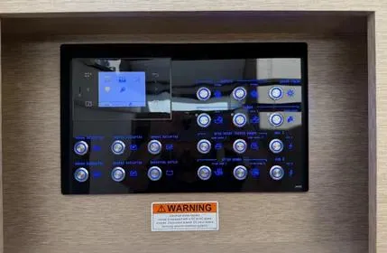 Slide: The Image of Control panel of a 2018 Prestige 680 yacht with illuminated buttons and warning label. - 10