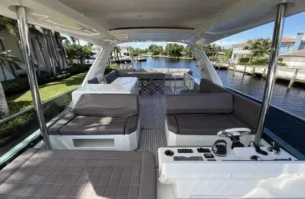 Slide: The Image of Luxurious 2018 Prestige 680 yacht interior with spacious seating and scenic waterfront view. - 18