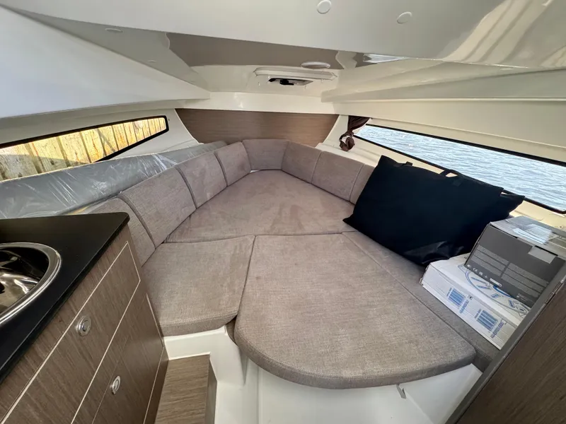 Slide: The Image of 2024 Beneteau Flyer 8 SUNdeck cabin interior with cozy seating and modern design. - 11