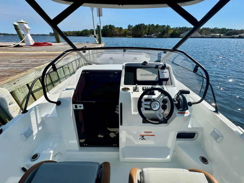 Slide: The Image of 2024 Beneteau Flyer 8 SUNdeck boat cockpit with steering wheel and Garmin navigation system. - 17