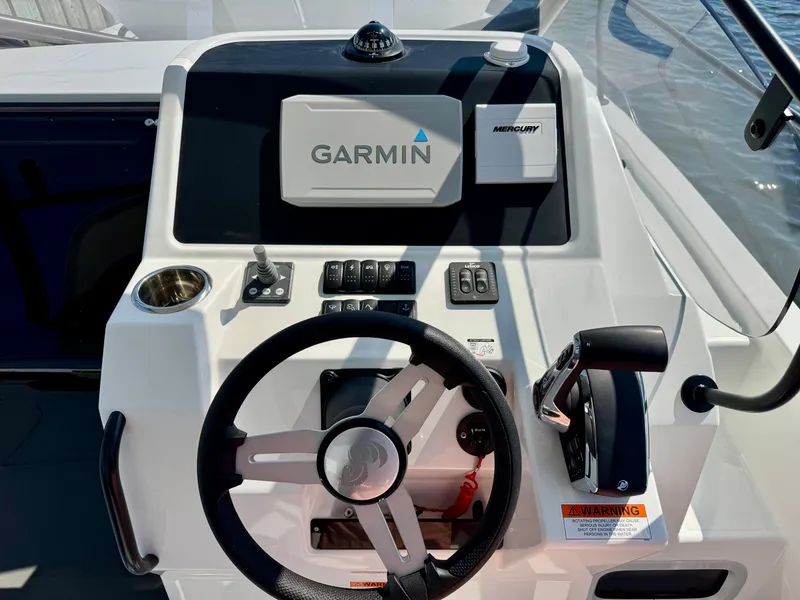 Slide: The Image of 2024 Beneteau Flyer 8 SUNdeck helm with Garmin navigation and Mercury controls. - 18