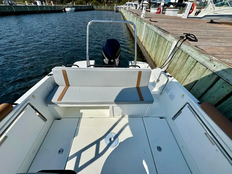 Slide: The Image of 2024 Beneteau Flyer 8 SUNdeck at dock, showcasing spacious seating and sleek design. - 19