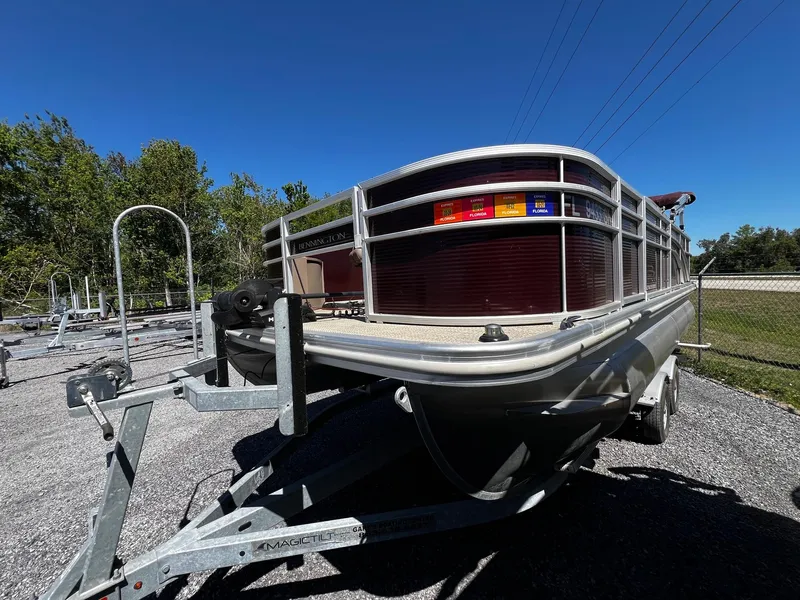 Slide: The Image of 2019 Bennington SX20 SFX pontoon boat on trailer, parked outdoors. - 3