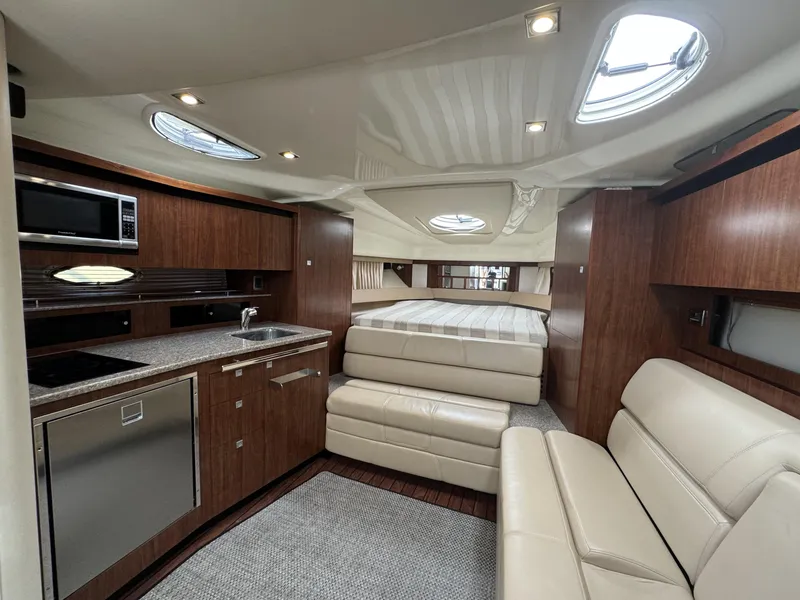 Slide: The Image of Luxurious interior of 2014 Monterey 340 Sport Yacht with modern kitchen and seating. - 12
