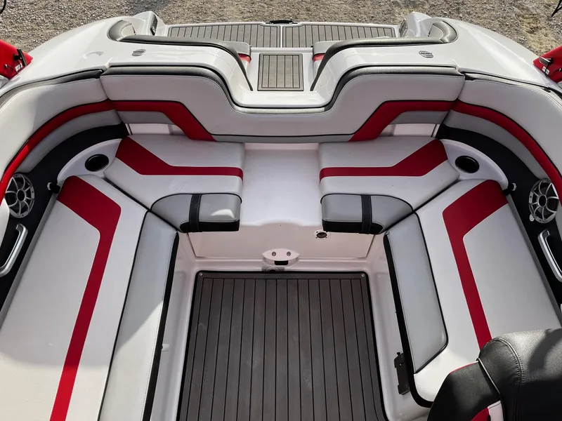 Slide: The Image of 2018 Yamaha Boats 242X E-Series interior with red and white seating, modern design. - 10