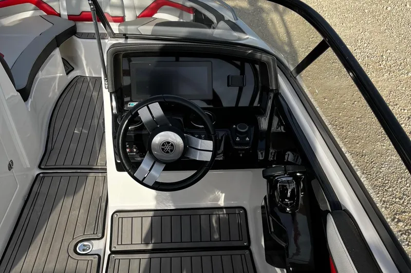 Slide: The Image of 2018 Yamaha Boats 242X E-Series dashboard with steering wheel and control panel. - 8
