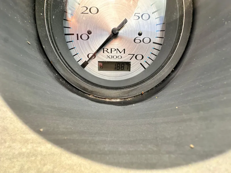 Slide: The Image of Close-up of a 2019 Bennington 20 SLM Pontoon RPM gauge displaying 1887. - 7