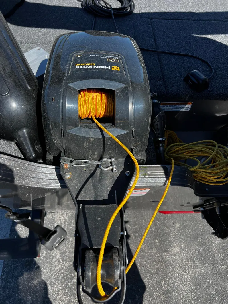 Slide: The Image of 2023 Crestliner 1600 Vision boat with Minn Kota trolling motor and yellow rope. - 12