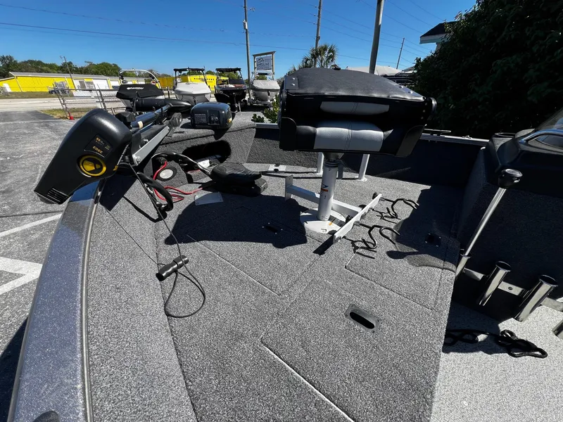 Slide: The Image of 2023 Crestliner 1600 Vision boat interior with seating and equipment on a sunny day. - 9