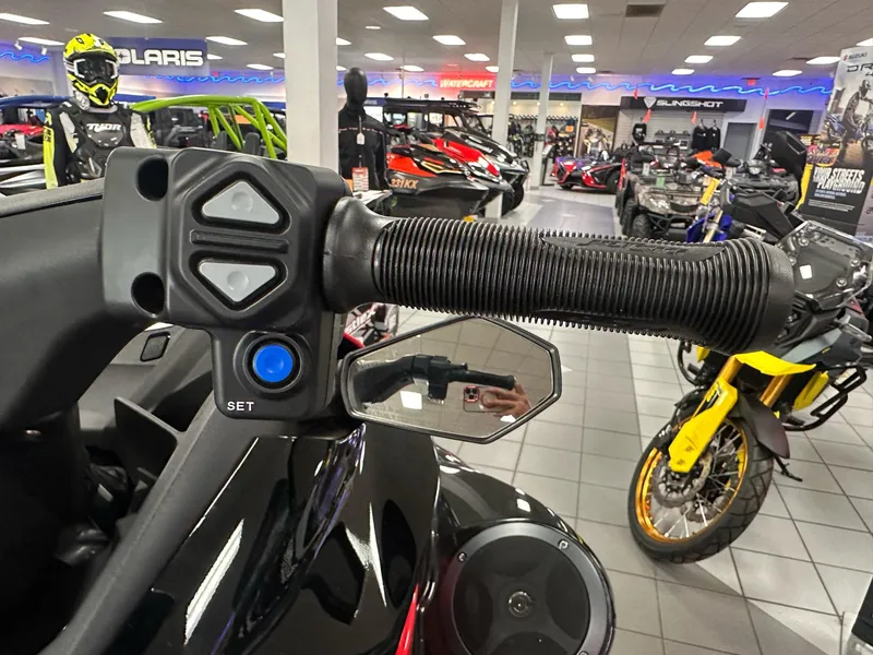 Slide: The Image of 2025 Kawasaki Jet Ski STX 160LX handlebar and controls in showroom setting. - 7