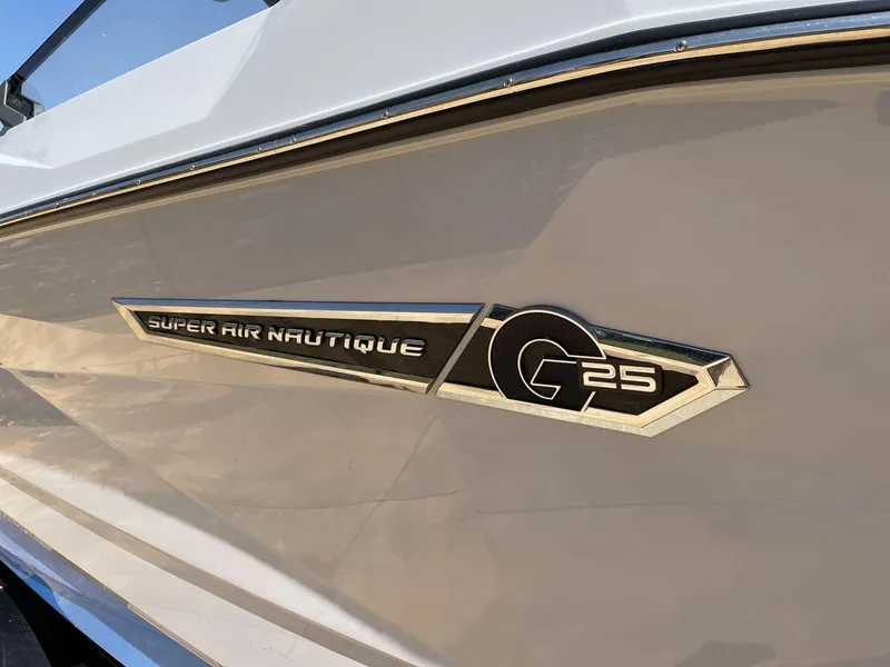 Slide: The Image of 2025 Nautique Super Air Nautique G25 logo on boat exterior. - 11
