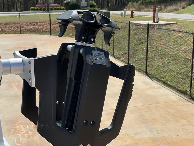 Slide: The Image of 2025 Nautique Super Air Nautique G25 wakeboard rack, black, mounted on a boat. - 16