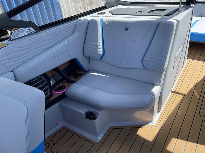Slide: The Image of 2025 Nautique Super Air Nautique G25 interior with luxurious seating and modern design. - 22