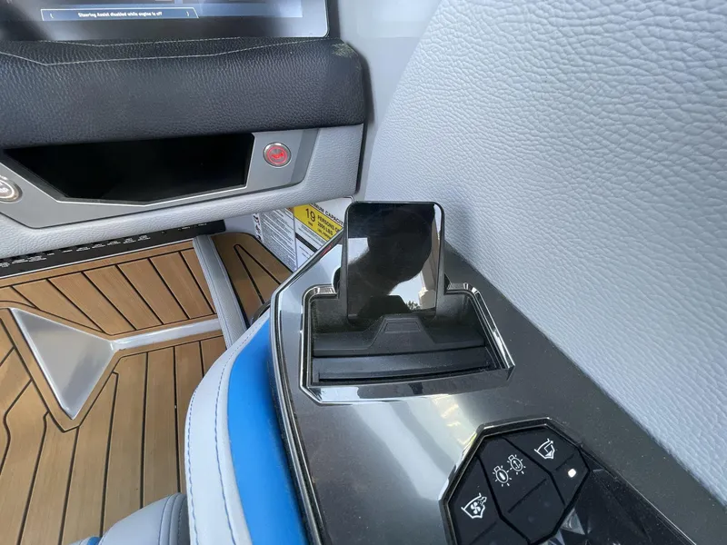 Slide: The Image of Interior of 2025 Nautique Super Air Nautique G25, featuring sleek controls and modern design. - 29
