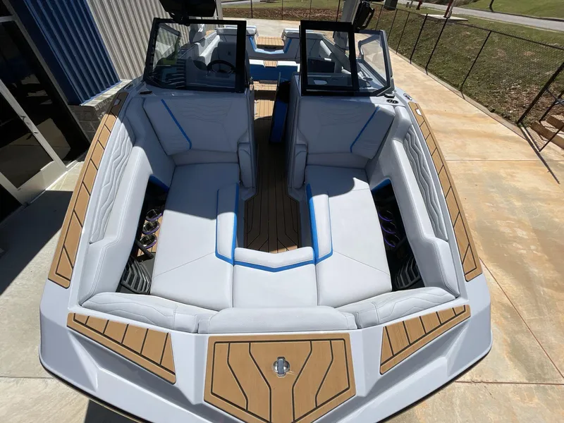 Slide: The Image of 2025 Nautique Super Air Nautique G25 boat interior with sleek seating and modern design. - 32