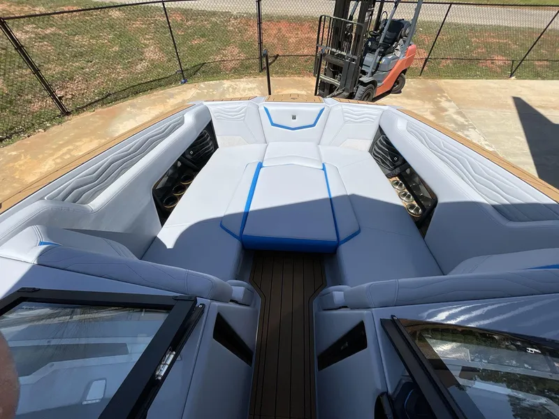 Slide: The Image of 2025 Nautique Super Air Nautique G25 boat interior with spacious seating and modern design. - 33