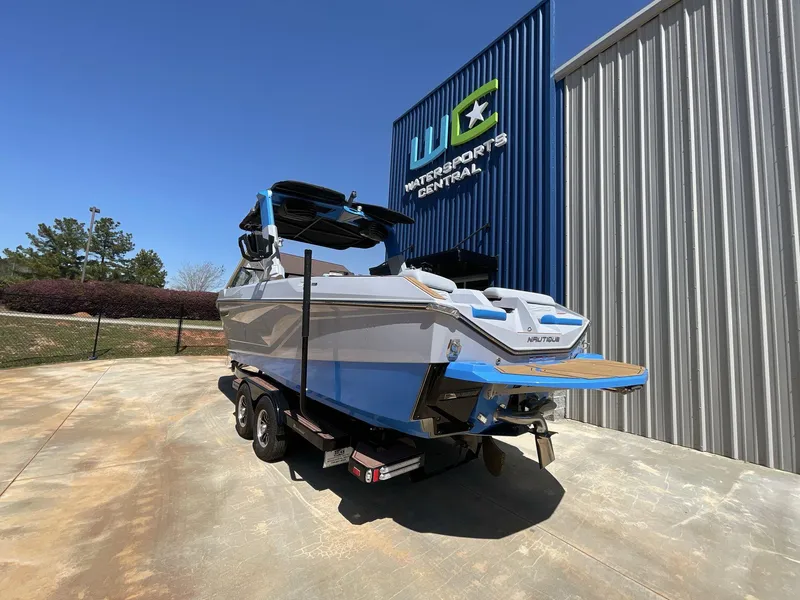 Slide: The Image of 2025 Nautique Super Air Nautique G25 boat on trailer at Watersports Central. - 5