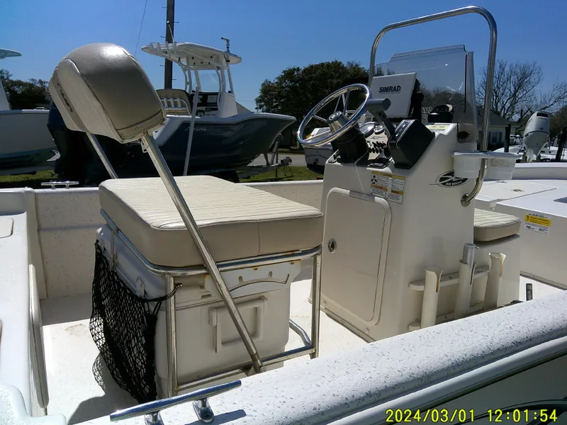 Slide: The Image of 2016 Carolina Skiff JVX16 boat interior with steering console and seating. - 13