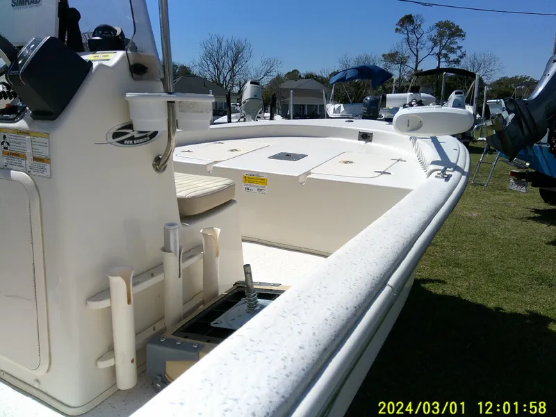 Slide: The Image of 2016 Carolina Skiff JVX16 boat on display, featuring a spacious deck and control console. - 14