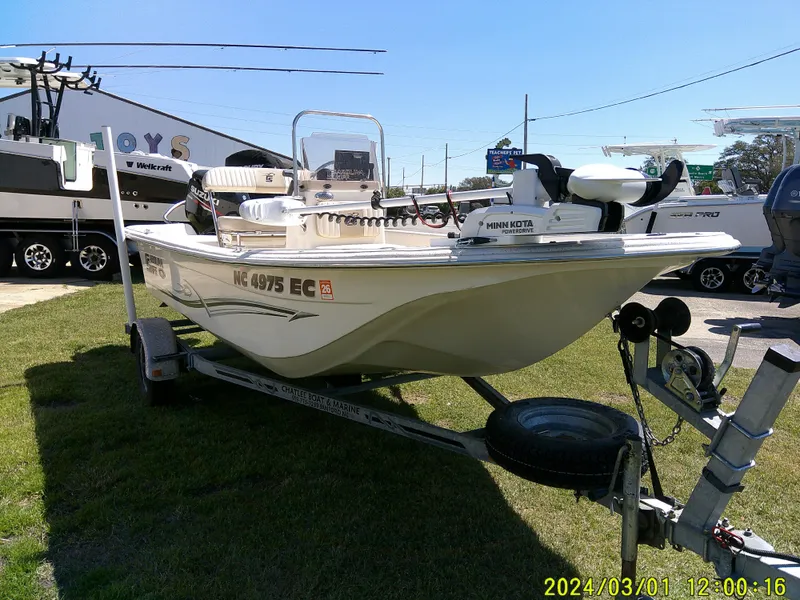 Slide: The Image of 2016 Carolina Skiff JVX16 boat on trailer, parked outdoors. - 2