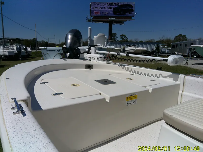 Slide: The Image of 2016 Carolina Skiff JVX16 boat deck with seating, displayed outdoors. - 5