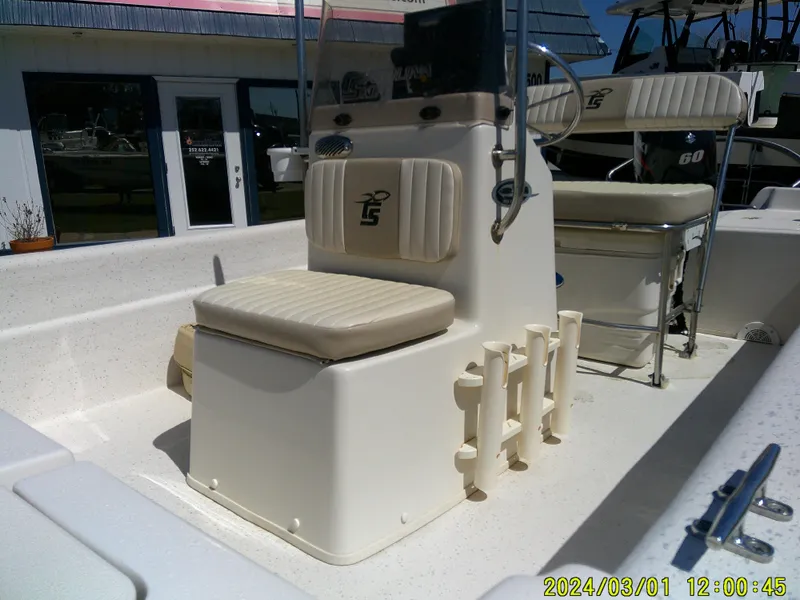 Slide: The Image of 2016 Carolina Skiff JVX16 boat interior with seating and rod holders. - 6