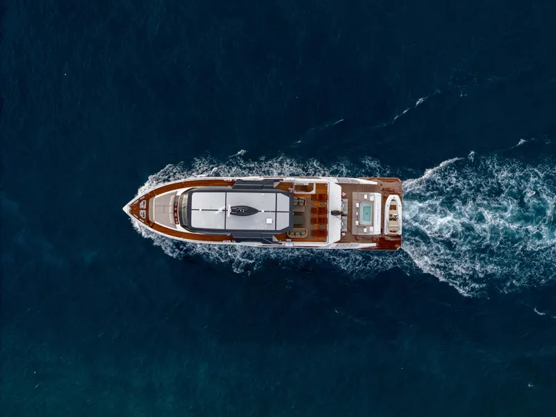 Slide: The Image of Aerial view of 2025 Alpha Squalo Co Ownership yacht cruising in deep blue ocean. - 13