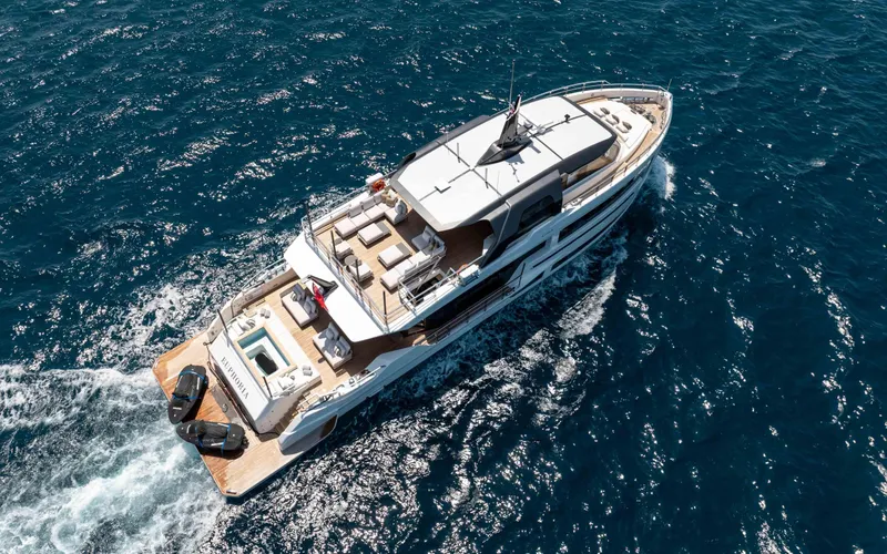 Slide: The Image of Luxurious 2025 Alpha Squalo Co Ownership yacht cruising on open sea. - 2