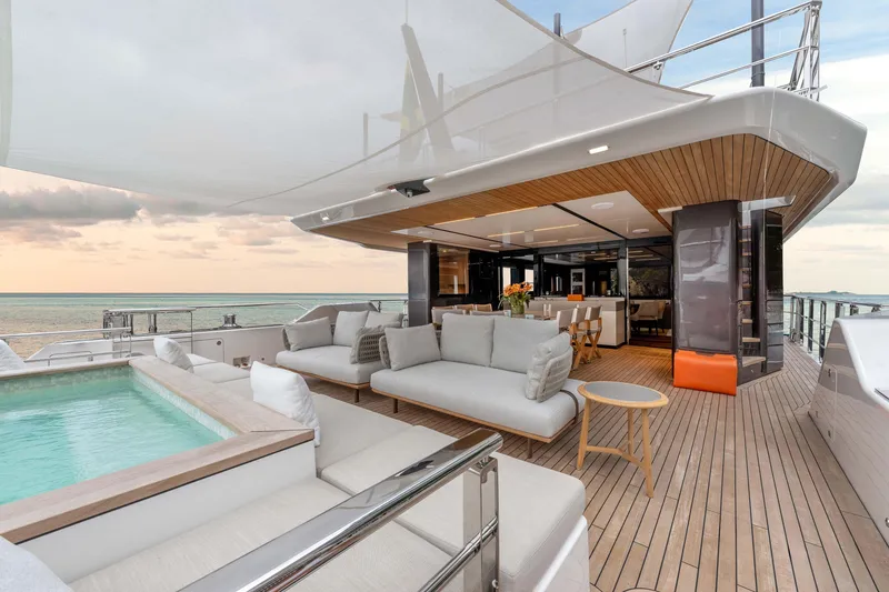 Slide: The Image of Luxurious 2025 Alpha Squalo Co Ownership yacht with elegant deck and pool at sunset. - 45