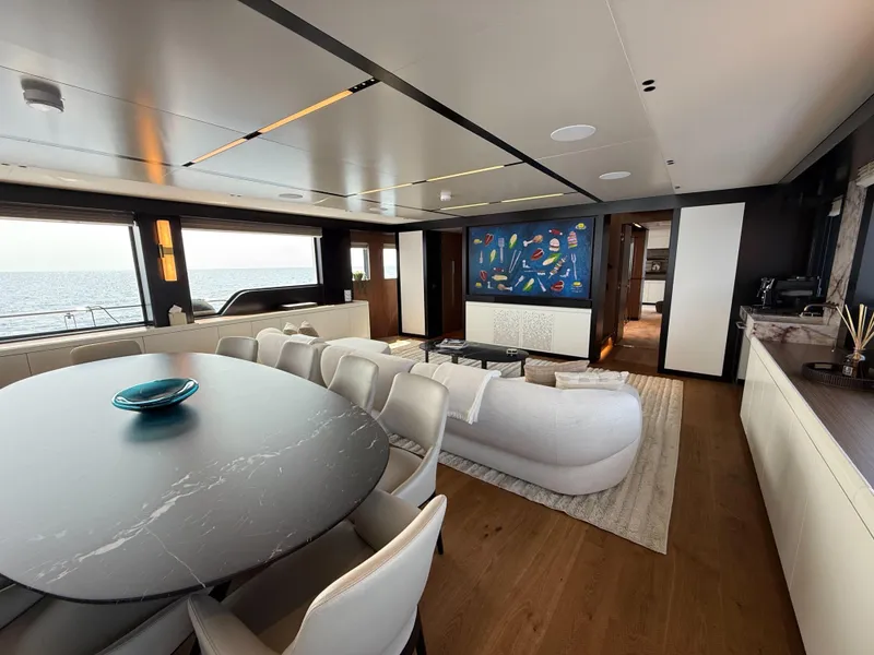 Slide: The Image of Luxurious interior of 2025 Alpha Squalo Co Ownership yacht with modern dining and living area. - 5