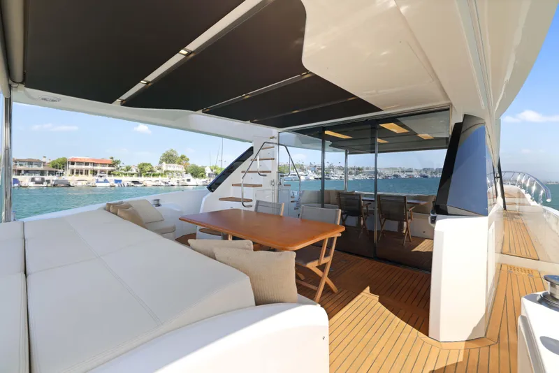 Slide: The Image of Luxurious 2015 Absolute Fly Co Ownership yacht with spacious deck and elegant seating area. - 10