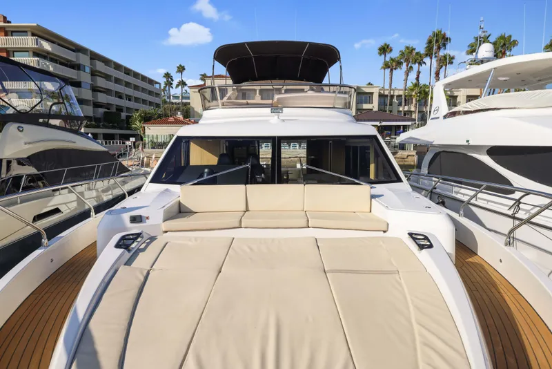 Slide: The Image of Luxurious 2015 Absolute Fly Co Ownership yacht docked at marina with spacious sun deck. - 13