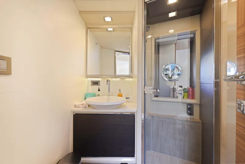 Slide: The Image of Luxurious yacht bathroom with modern fixtures, mirror, and shower; Absolute Fly Co Ownership 2015. - 17