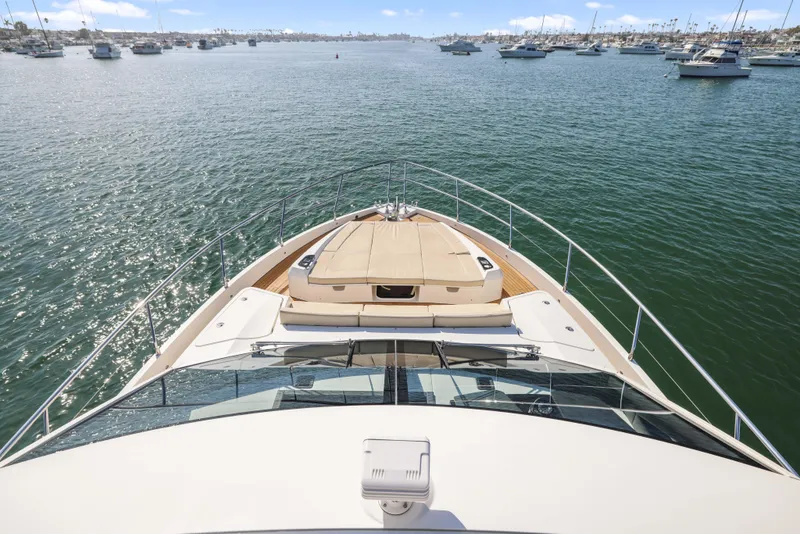 Slide: The Image of Bow view of 2015 Absolute Fly Co Ownership yacht on calm waters. - 2