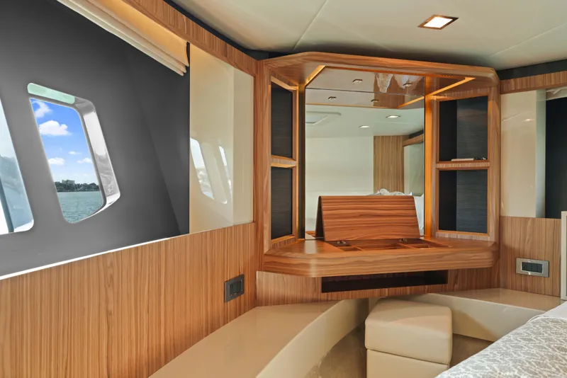 Slide: The Image of Luxurious yacht interior with wood finish, seating, and windows; Absolute Fly Co Ownership 2015 model. - 22