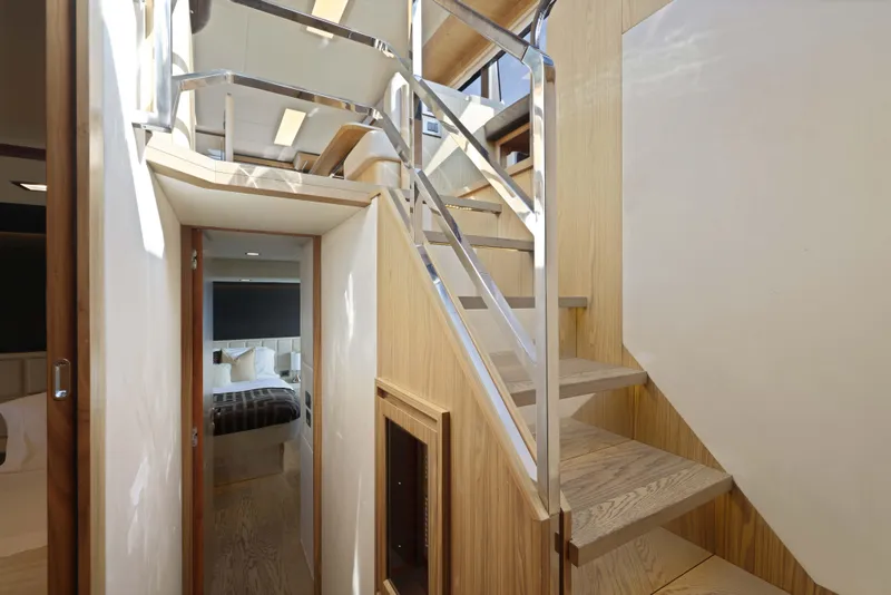 Slide: The Image of Interior of 2015 Absolute Fly Co Ownership yacht with modern staircase and cozy bedroom. - 26