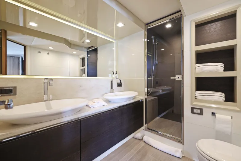Slide: The Image of Luxurious yacht bathroom with dual sinks, glass shower, and modern design, Absolute Fly Co Ownership 2015. - 35