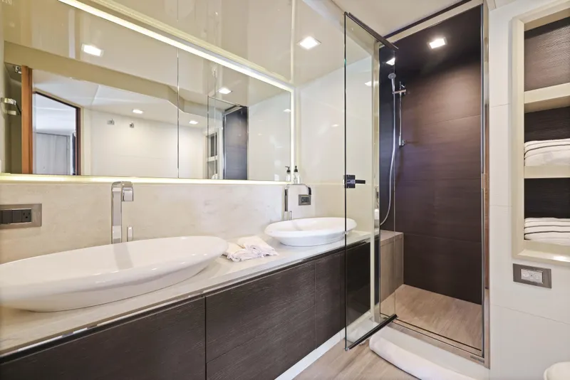 Slide: The Image of Luxurious yacht bathroom with dual sinks, glass shower, and modern design, Absolute Fly Co Ownership 2015. - 36
