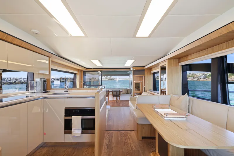 Slide: The Image of Luxurious interior of 2015 Absolute Fly Co Ownership yacht with modern kitchen and dining area. - 4
